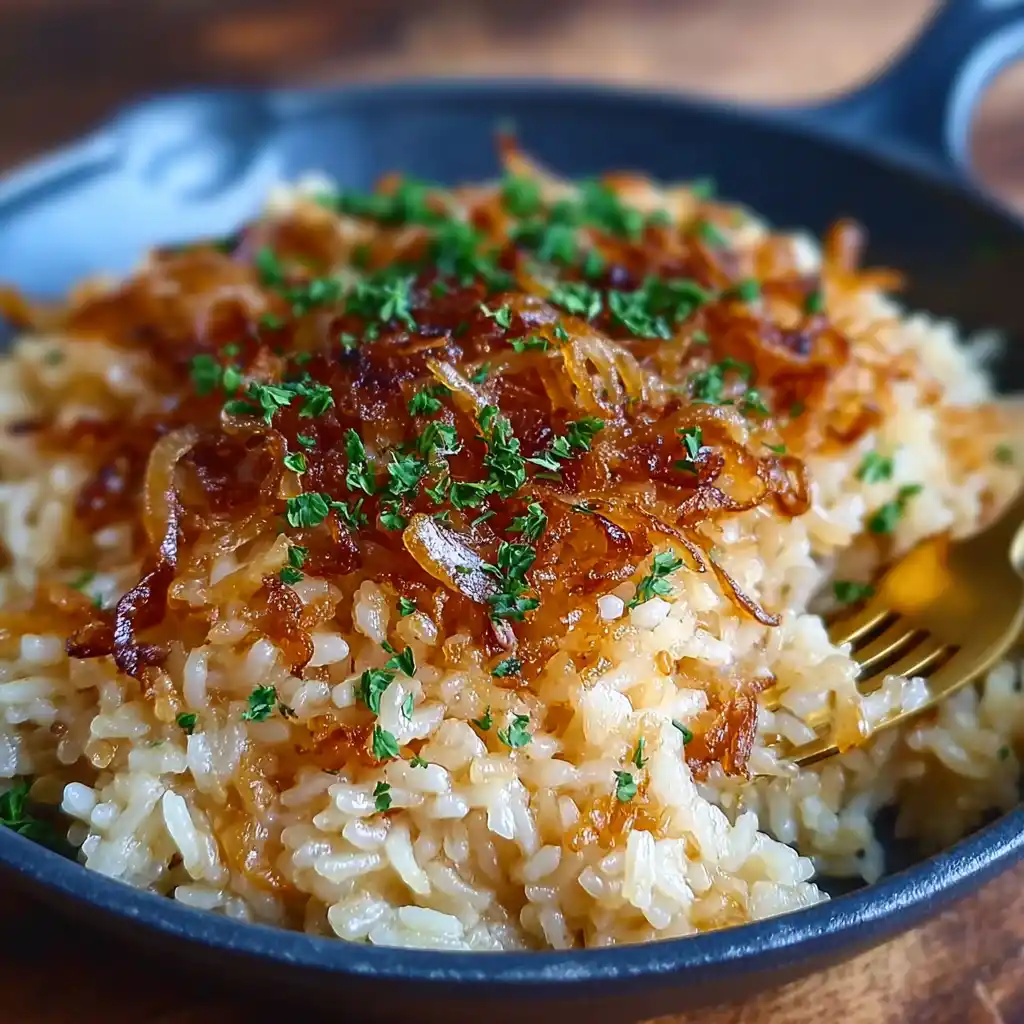 French onion rice served in a rustic bowl